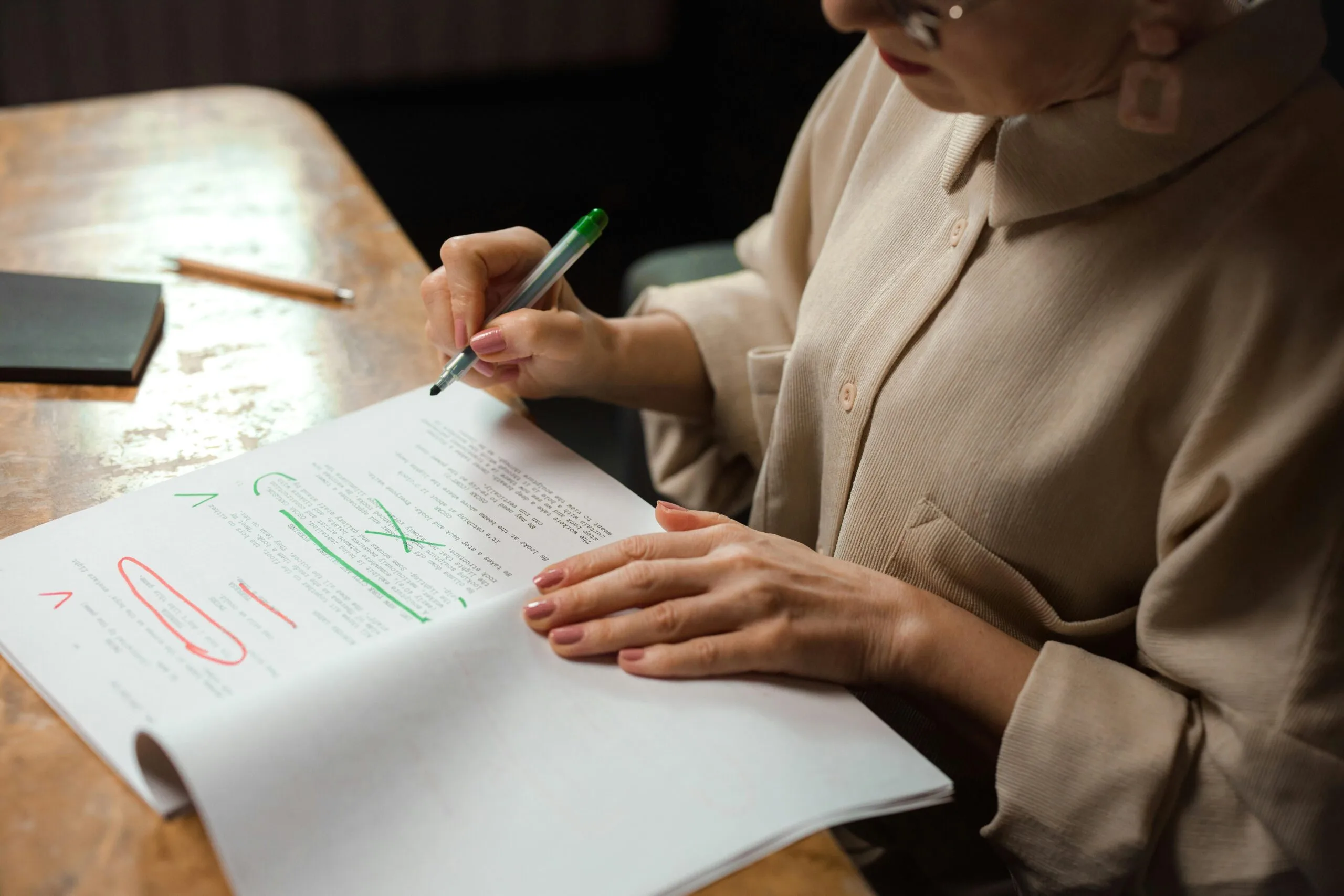 woman proofreading on a table