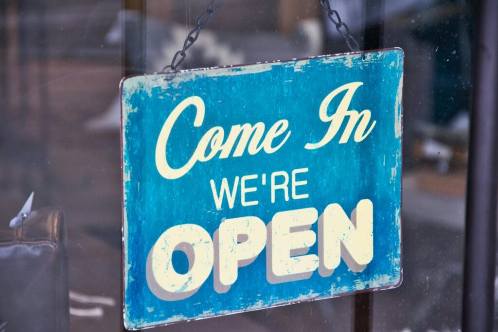 teal and white open sign
