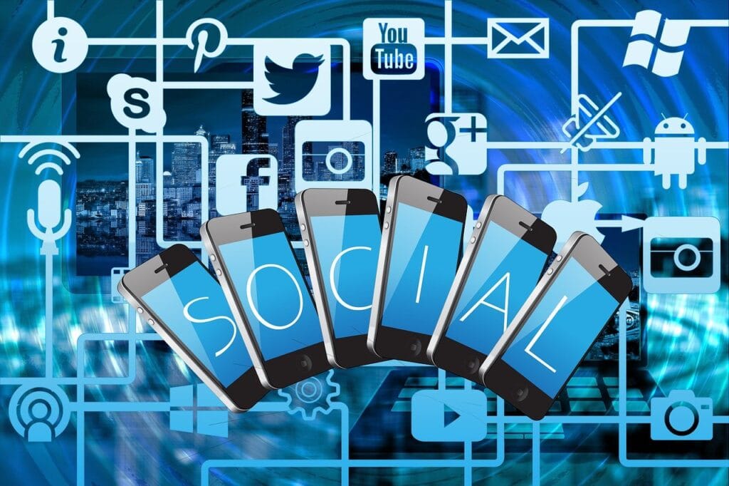 graphics of all social media platforms above the word "social" spelled out using mobile devices